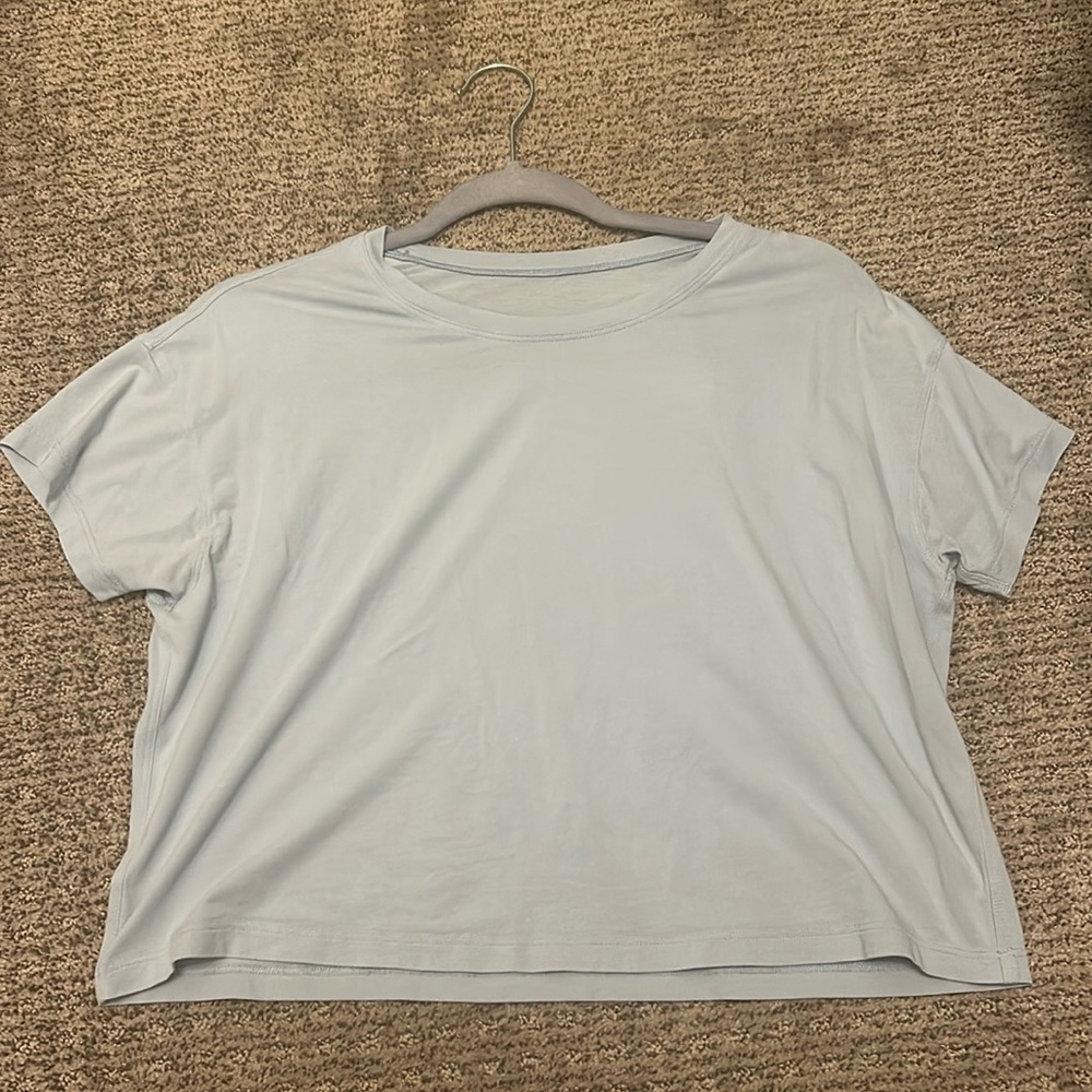 light blue cropped lululemon shirt